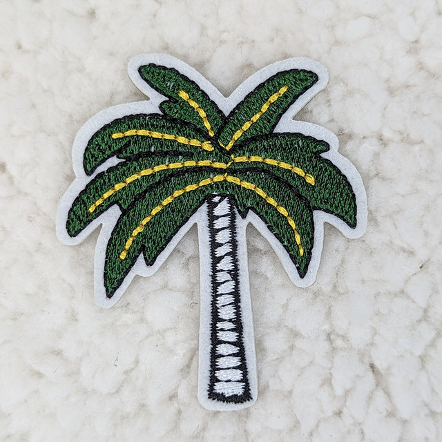 Dark Palm Tree Embroidered HAT/POCKET Patch, green and yellow embroidered palm tree patch with white border on light background.