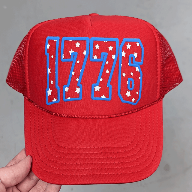 1776 Blue PUFF Hat/Pocket Screen Print Heat Transfer, red baseball cap with a blue outlined '1776' design filled with white stars.