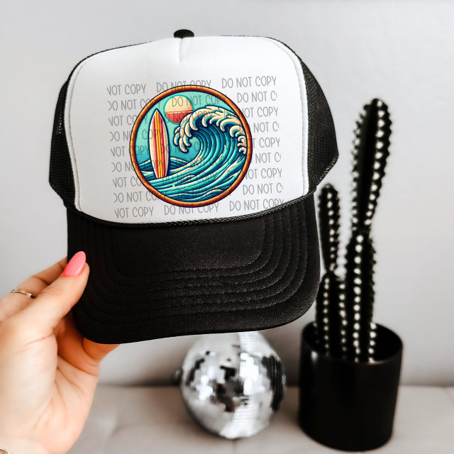 Surfside Faux Patch Sublimation Transfer, a patch with a colorful waves and surfboard design on a trucker hat.