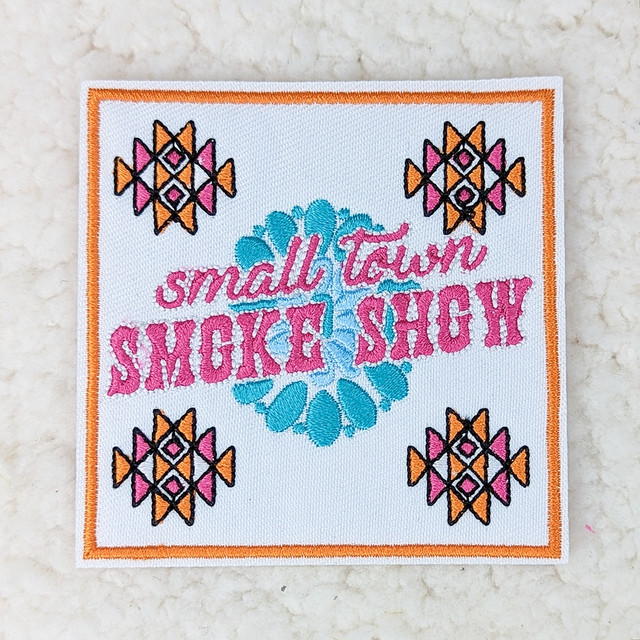 Small Town Smoke Show Embroidered HAT/POCKET Patch, colorful embroidered patch featuring floral and geometric designs in pink, orange, black, and blue.