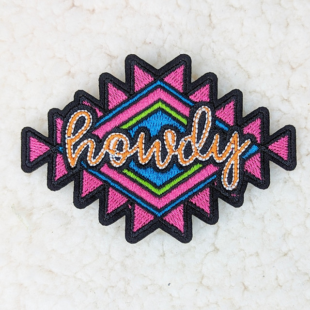 Howdy Western Embroidered HAT/POCKET Patch, colorful embroidered patch with pink, blue, green, and orange designs and the word 'howdy' stitched in orange.