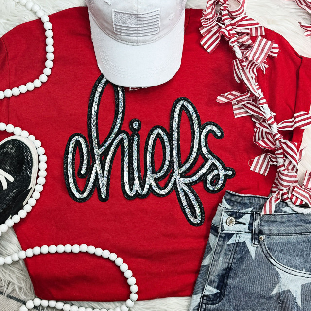 Chiefs Sequin Patch, a black and silver sequined patch with the word 'Chiefs' written in cursive on a red t-shirt.