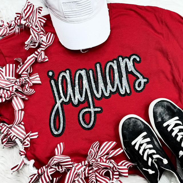 Jaguars Sequin Patch, a close-up of a black and silver sequin patch with the word 'Jaguars' on red fabric, featuring decorative white and black pattern.
