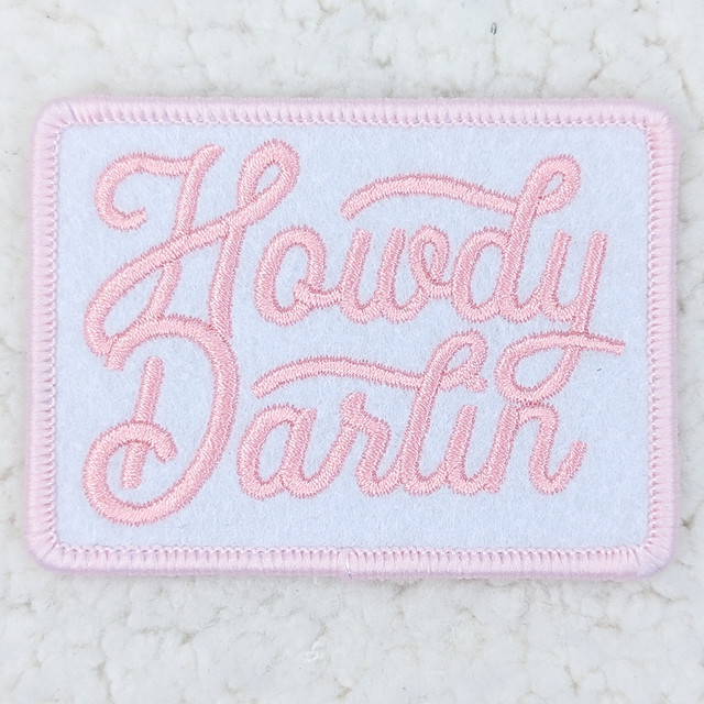 Howdy Darlin PINK Embroidered HAT/POCKET Patch, pink embroidered patch with the brand name 'Howdy Darlin' stitched in cursive on a white background with a pink border.