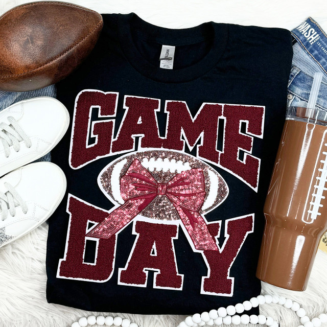 Maroon Chenille Football Game Day with Sequin Bow Patch, a black t-shirt featuring large maroon chenille lettering, a decorative sequin bow patch, and football graphic, perfect for celebrating game day.