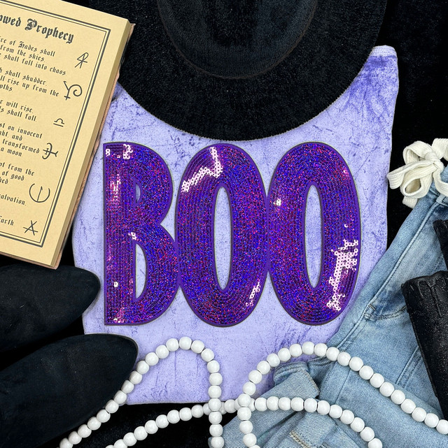 Purple BOO Sequin Patch, colorful sequin-embellished patch with the word 'BOO' in purple, on a clothing item.
