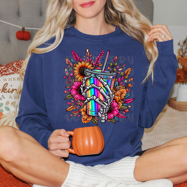 Fall Skeleton Drink DTF Heat Transfer, colorful skeleton hand holding a rainbow-colored drink cup with flowers in the background.