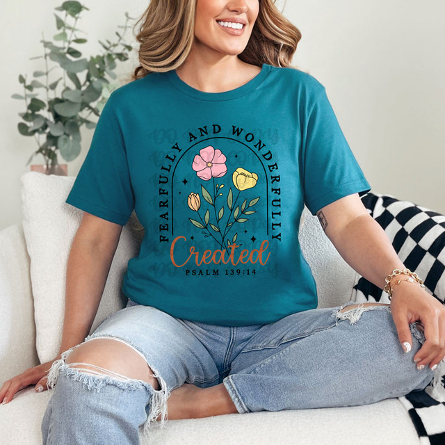 Fearfully And Wonderfully Created DTF Heat Transfer, a colorful floral design with biblical quote on a teal T-shirt.