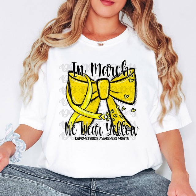 In March We Wear Yellow Endometriosis Awareness DTF Heat Transfer, a woman wearing a white T-shirt with a yellow bow design and text supporting endometriosis awareness.