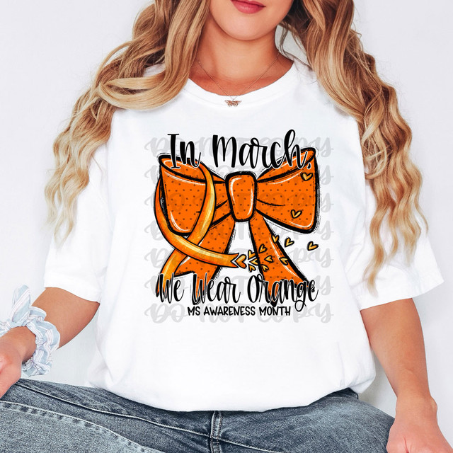 In March, We Wear Orange MS Awareness Month DTF Heat Transfer, a graphic T-shirt with a large orange bow design and text supporting multiple sclerosis awareness.