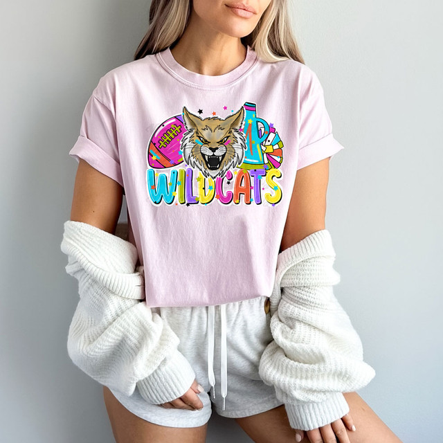 Wildcats Bright Mascot DTF Heat Transfer, colorful and vibrant mascot design featuring a wildcat and sports elements on a pink T-shirt.