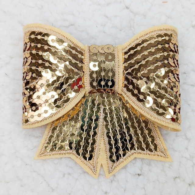 ALL GOLD Sequin Bow HAT/POCKET Patch, gold sequined bow accessory with a fabric border and detailed stitching.