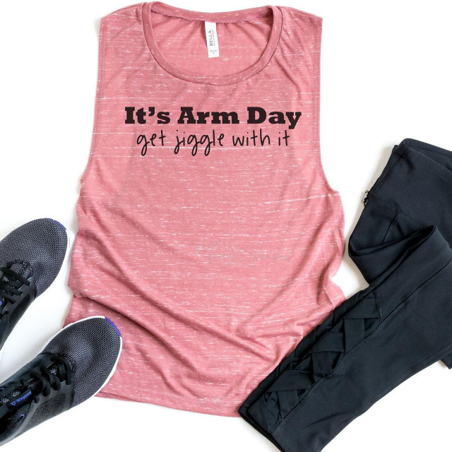 It's Arm Day Sublimation Transfer, pink sleeveless athletic shirt with motivational print, paired with black workout leggings and running shoes.