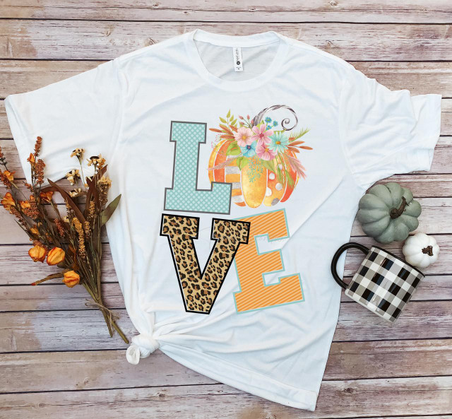 Love fall pumpkin Word Art Sublimation Transfer, decorative fall-themed shirt with colorful pumpkin and floral design.