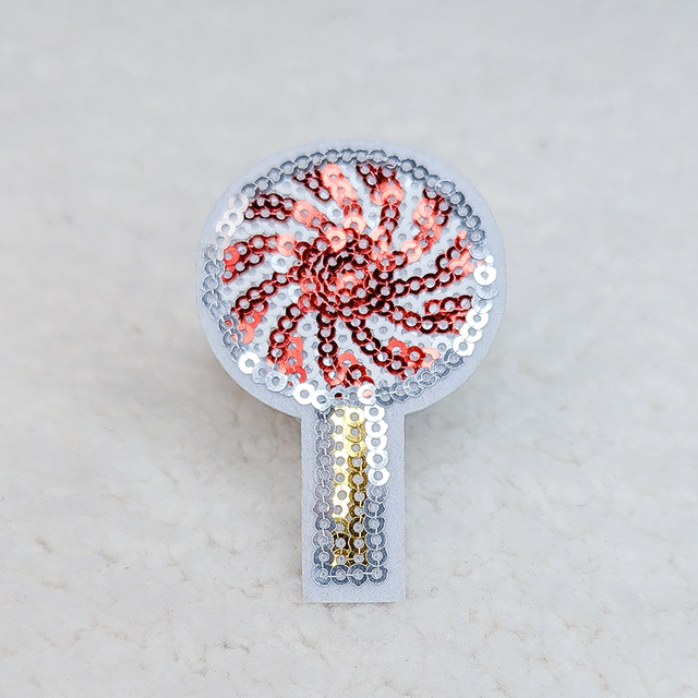 Peppermint Lollypop Sequin Hat/Pocket Patch, decorative sequin patch shaped like a peppermint lollypop with red and silver sequins on a white background.