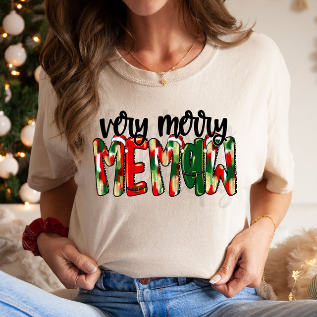 Very Merry Memaw DTF Heat Transfer, Christmas themed graphic with colorful holiday design on a woman's T-shirt.