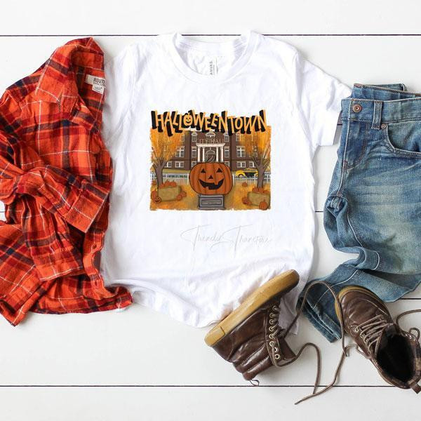HalloweenTown Sublimation Transfer, Halloween-themed graphic t-shirt with a pumpkin and haunted house design.
