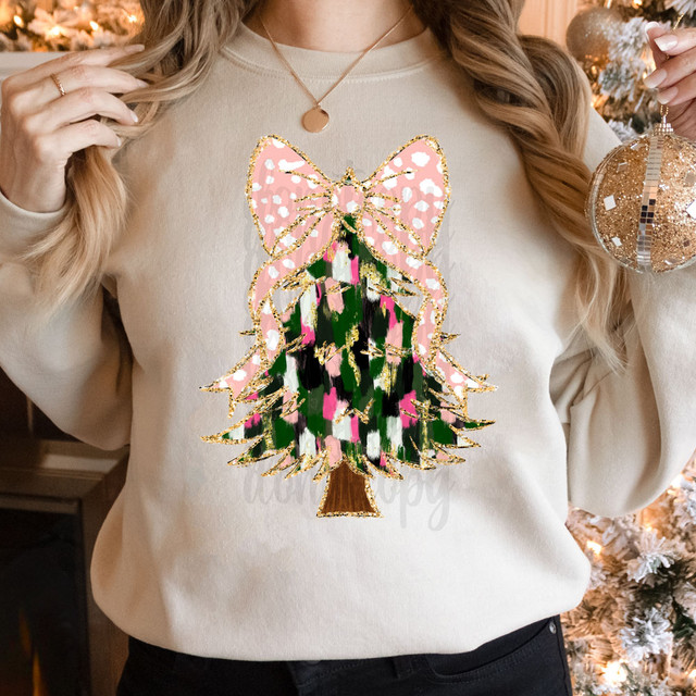 Brushstroke Pink/Green/Black Christmas Tree DTF Heat Transfer, floral Christmas tree design with pink, green, black, and gold accents on a woman's sweater.