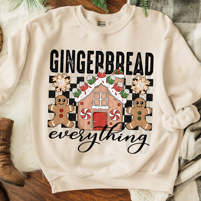 Gingerbread Everything DTF Heat Transfer, holiday-themed sweatshirt with gingerbread cookies, candy canes, snowflakes and a gingerbread house design for festive Christmas decorating.