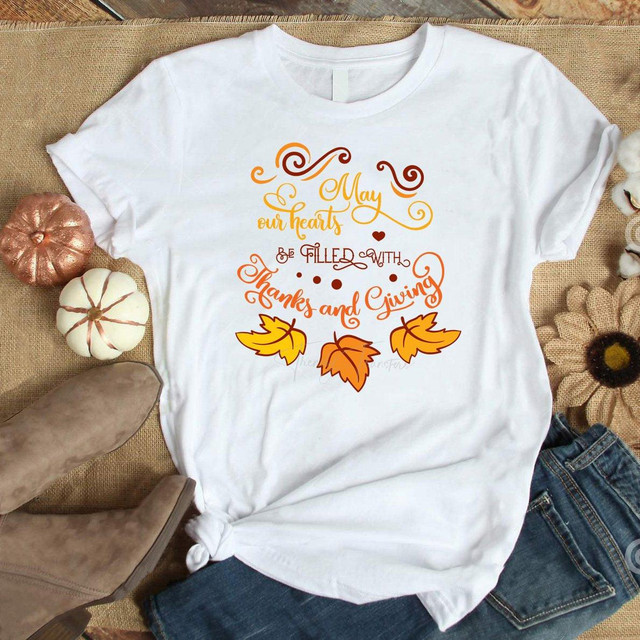 May our hearts be filled with thanks and giving Sublimation Transfer, white T-shirt with orange, yellow, and brown fall-themed text and leaf graphics.