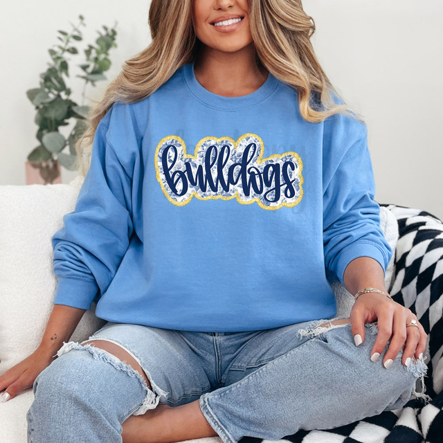 Bulldogs Blue Floral Mascot Faux Glitter DTF Heat Transfer, woman wearing a blue sweatshirt with a glitter Bulldogs design