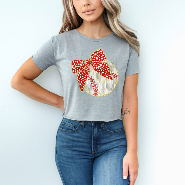 Baseball Coquette DTF Heat Transfer, decorative heat transfer design on a gray t-shirt featuring a baseball with a red bow and glitter embellishments.