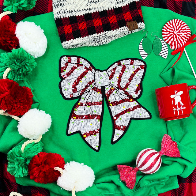 Snack Cake Sequin Bow Patch, holiday-themed sequin applique patch in the shape of a large bow with red and white stripes, decorated with colorful sequins.
