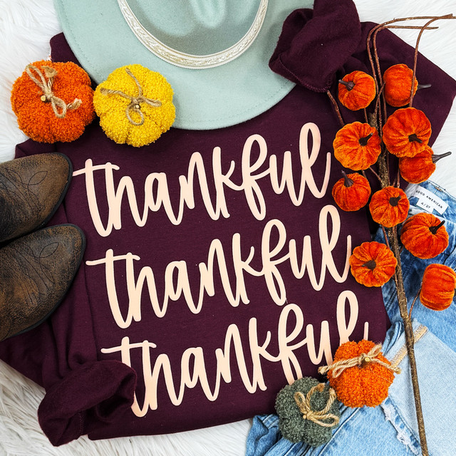 Stacked Thankful Tan PUFF Screen Print Heat Transfer, fall-themed pumpkins, hat, boots, and clothing on a cozy display.