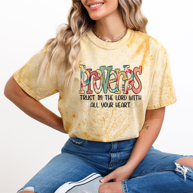 Proverbs 3: 5-6 DTF Heat Transfer, colorful and inspiring Bible verse design on a yellow tie-dye T-shirt worn by a woman.
