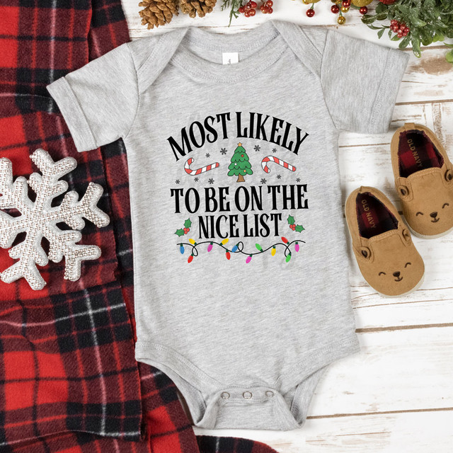 Most Likely To Be On The Nice List Festive DTF Heat Transfer, gray baby onesie with Christmas themed text and decorations.