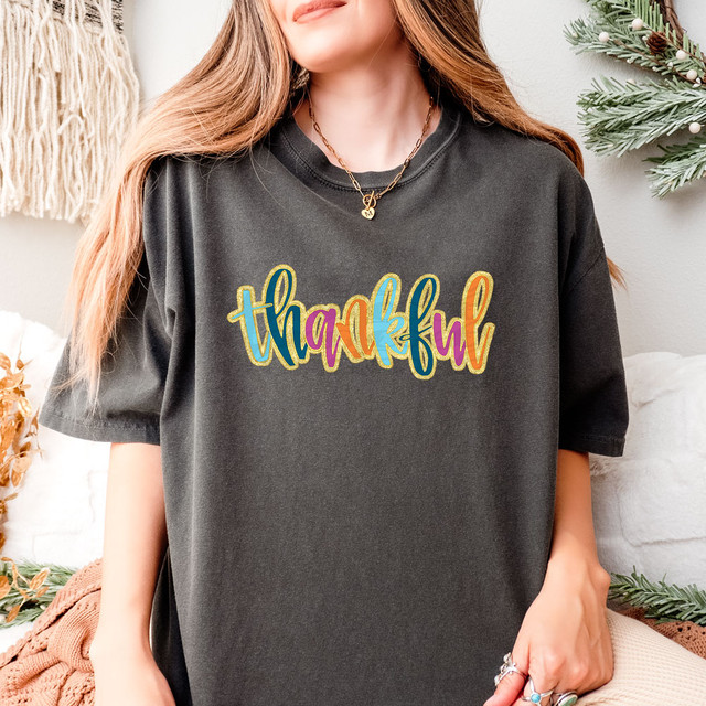 Thankful Faux Glitter DTF Heat Transfer, colorful glitter design on black T-shirt, festive holiday style.