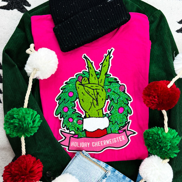 Chenille Holiday Cheermeister Patch, vibrant embroidered patch featuring a Christmas tree hand making a peace sign with the words 'Holiday Cheermeister' underneath.