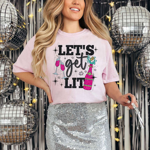 Let's Get Lit Faux Glitter DTF Heat Transfer, woman wearing a pink t-shirt with birthday celebration design, surrounded by silver disco balls.