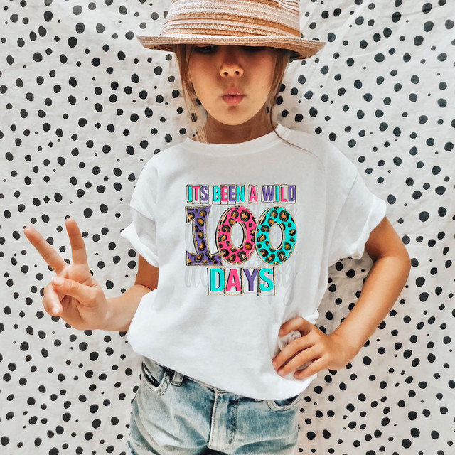Its Been A Wild 100 Days DTF Heat Transfer, a colorful and vibrant heat transfer design with the phrase 'It's Been A Wild 100 Days' on a white t-shirt.