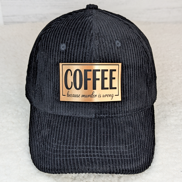 Coffee Because Murder Is Wrong FAUX Leather Patch - black corduroy cap with a rectangular faux leather patch featuring the text 'COFFEE because murder is wrong'.