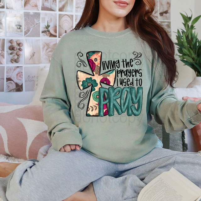 Living The Prayers I Used To Pray DTF Heat Transfer, colorful and inspirational prayer-themed design on a sweatshirt.