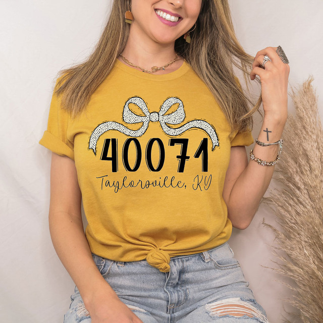 Product Taylorsville, KY Zip Code Bow DTF Heat Transfer, yellow T-shirt with zip code and city name printed with bow design for custom apparel.