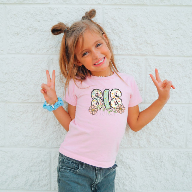 Sis Easter Pattern DTF Heat Transfer, colorful Easter-themed design on a pink children's t-shirt.