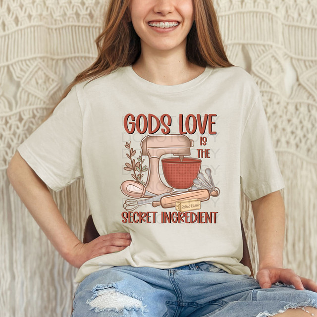 Gods Love Is The Secret Ingredient DTF Heat Transfer, graphic design of kitchen utensils with text and salted butter illustration.