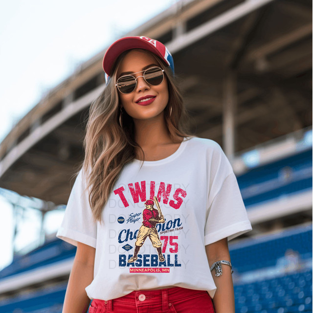 Vintage Twins Baseball DTF Heat Transfer, product of a woman wearing a white t-shirt with vintage twin baseball graphic design at a stadium.