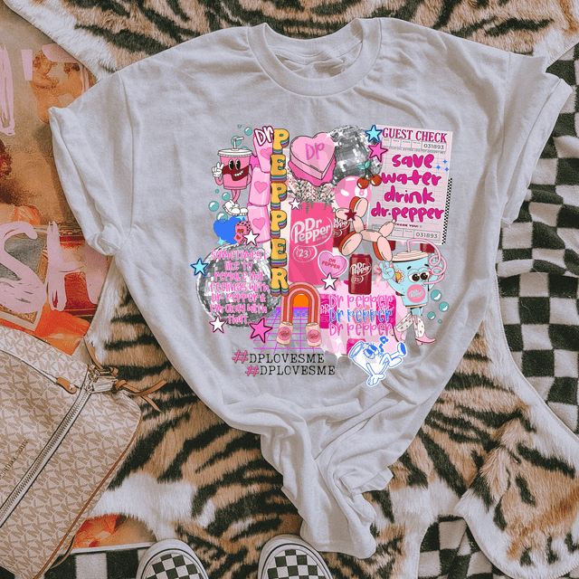 DP Collage DTF Heat Transfer, colorful cartoon-style design featuring soda bottles, cups, hearts, stars, and text on a white T-shirt.