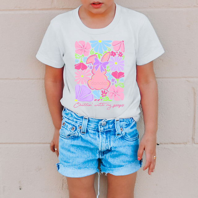 Chillin' With My Peeps Floral DTF Heat Transfer, colorful floral Easter bunny design on a white T-shirt worn by a young girl.