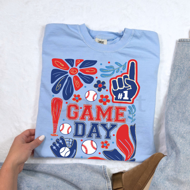 Boho Baseball Gameday DTF Heat Transfer, colorful graphic design on a light blue t-shirt featuring baseball-themed elements and text