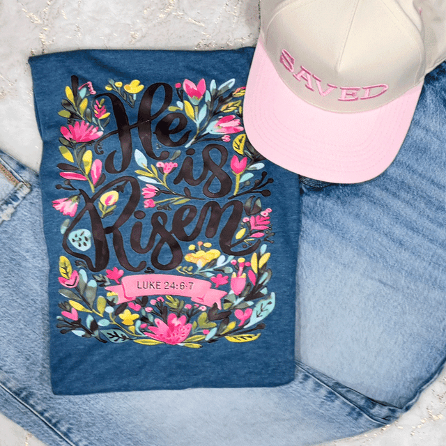 He Is Risen CLEAR Screen Print Heat Transfer, colorful floral design with scripture Luke 24:6-7 printed on a dark fabric.
