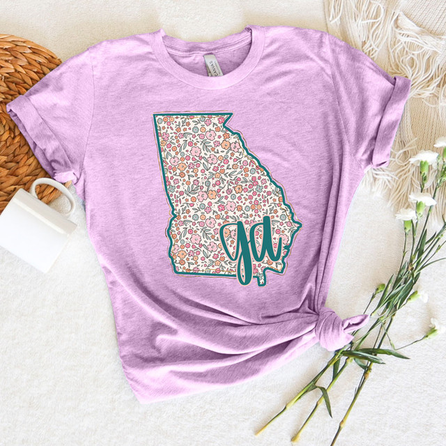 GA Spring Floral DTF Heat Transfer, floral patterned map of Georgia on a pink T-shirt.