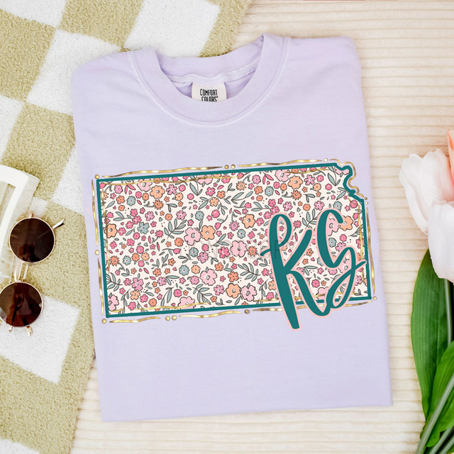 KS Spring Floral DTF Heat Transfer, purple T-shirt with a colorful floral design and monogram initials 'K G'.