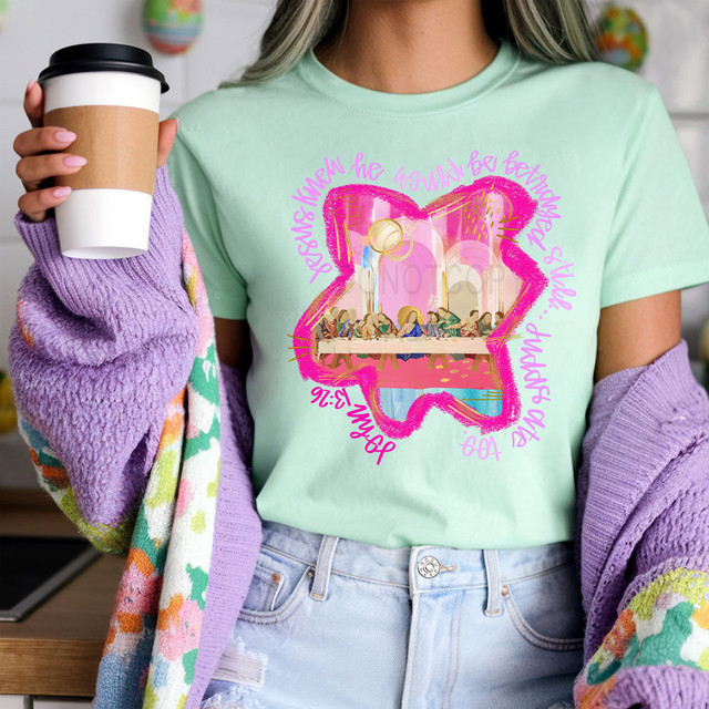 Painted Judas Ate Too DTF Heat Transfer, colorful graphic design of a heart with a scene of people at a table inside, surrounded by pink text.