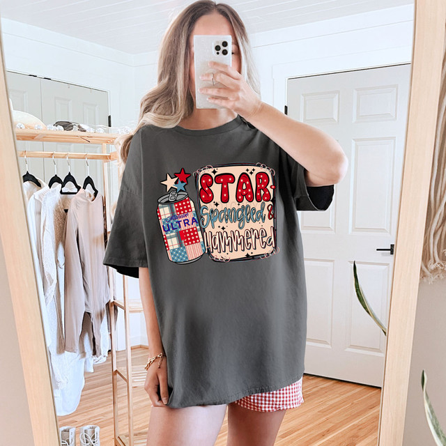 Star Spangled & Hammered Ultra DTF Heat Transfer, graphic design with patriotic stars and American flag motif on a dark gray T-shirt.