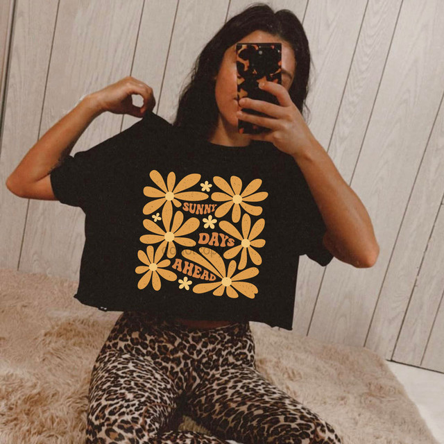 Sunny Days Ahead DTF Heat Transfer, black T-shirt with orange floral design and text.