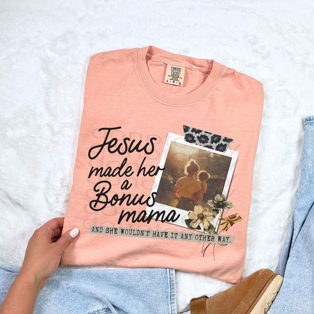 Jesus Made Her A Bonus Mama DTF Heat Transfer, pink t-shirt with floral and photo design.